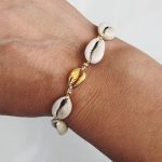 Cowrie shell bracelet with golden details