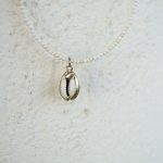 Tiny howlite and cowrie shell necklace